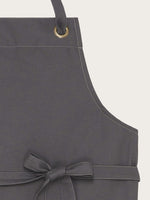 détail tresse de cou tablier polka