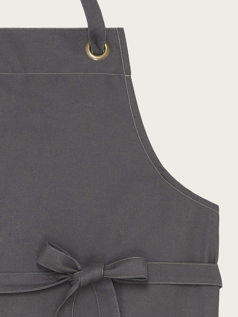 détail tresse de cou tablier polka