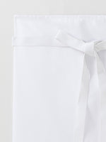 détail tablier Swing piqué à plat