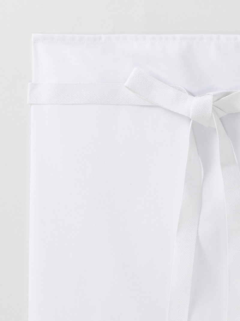 détail tablier Swing piqué à plat